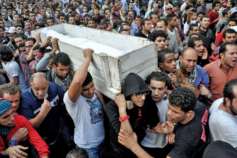 Egyptians carry the body of Gaber Salah during his funeral procession in Cairo on Nov. 26.