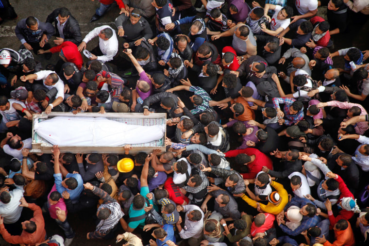 Egyptian activists carry the coffin of Gaber Salah, an activist who died overnight after he was critically injured in clashes with police last week, during his funeral in Tahrir Square on Nov. 26.