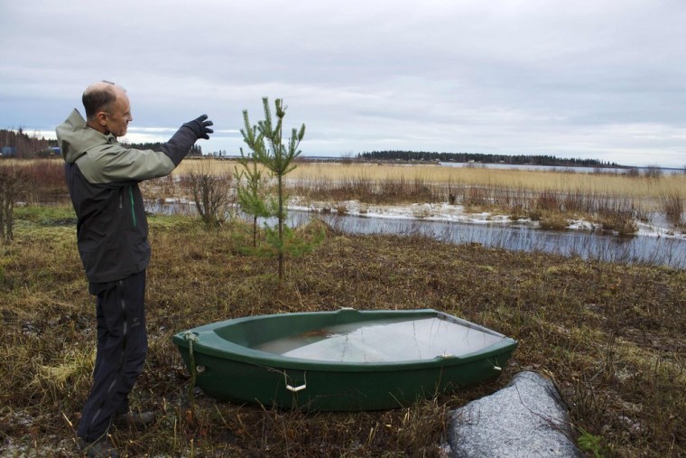 Hans Lindberg, a 56-year-old Swede, points toward an area of reeds that has risen from the Baltic Sea, forming a land bridge to what used to be an island where he spent his summers as a child in the early 1960s.