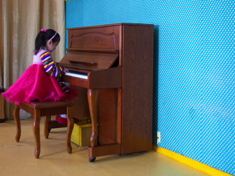 In this March 9, 2011 photo, a girl plays the piano inside the Changgwang Elementary School in Pyongyang, North Korea. (AP Photo/David Guttenfelder)