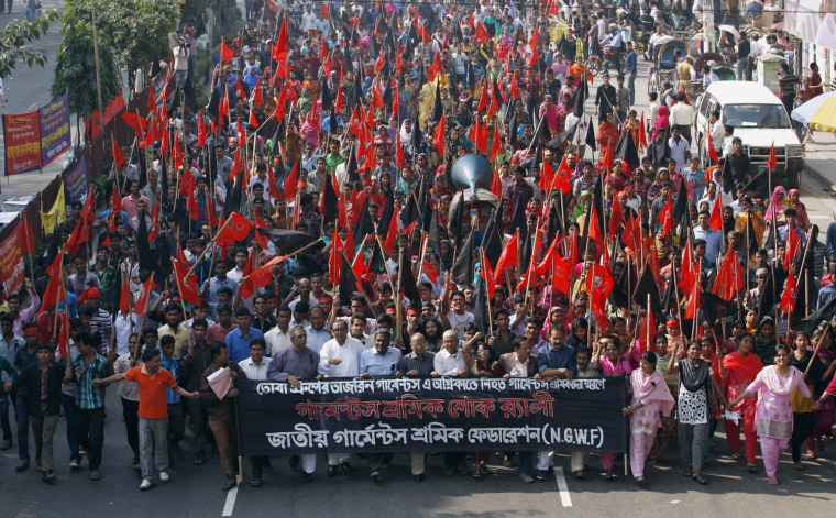 Garment workers shout slogans as they attend a mourning procession for the workers killed in the Ashlia fire accident in Dhaka, Bangladesh Nov. 27.
