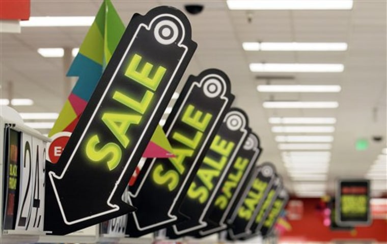 Sale signs are displayed Nov. 23 at a Target store in Colma, Calif.