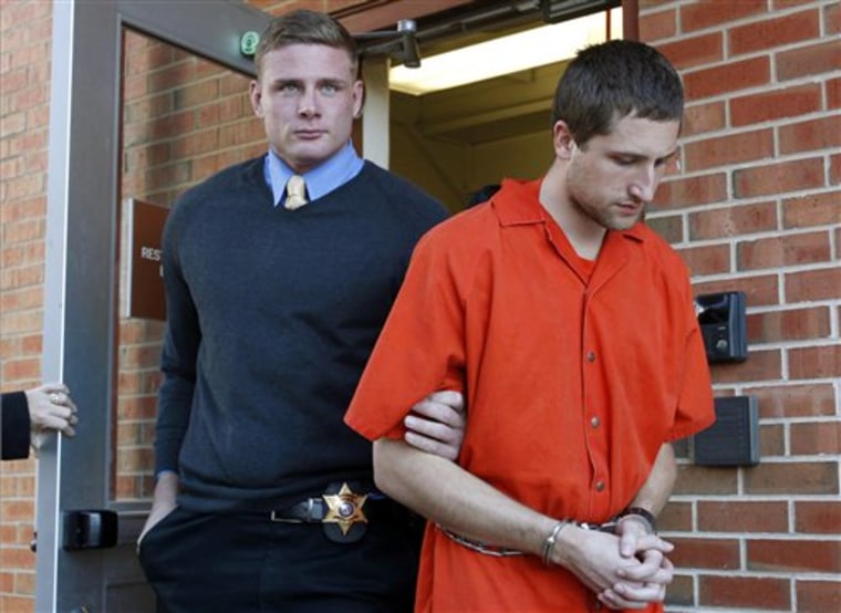 In this Nov. 13 file photo, Micah Moore, 23, is escorted into the Jackson County Courthouse Annex in Independence, Mo., for his murder charge in the death of 27-year-old Bethany Ann Deaton.