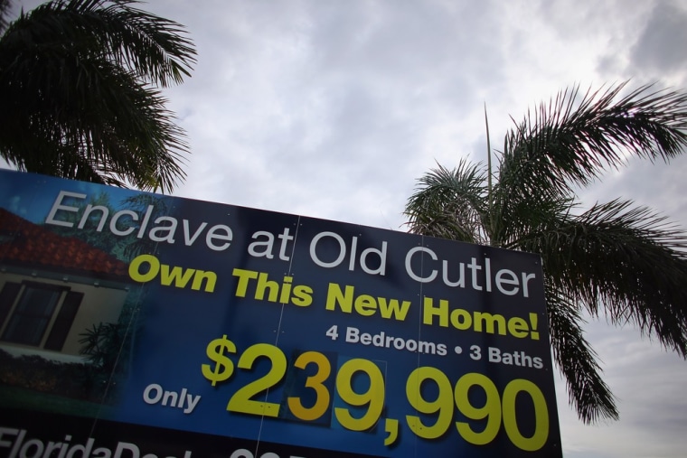 A sign advertising new homes for sale is seen on October 24, 2012 in Miami, Florida. New home sales edged lower last month.