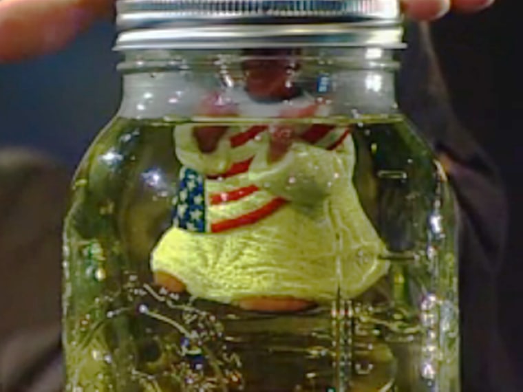 Glenn Beck's Obama bobblehead floating in a jar of what he joked was
