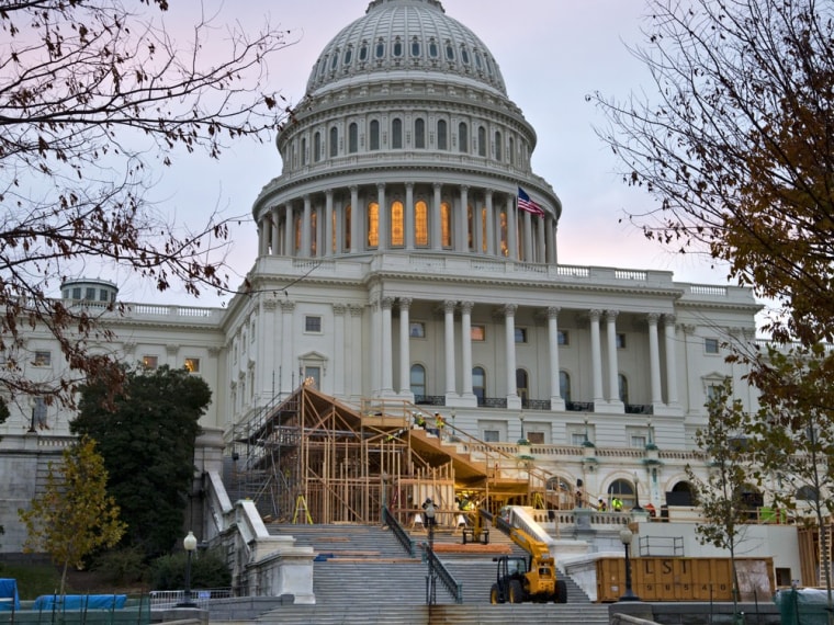 Construction continues on the viewing stands for President Barack Obama's January's Inauguration Day ceremonies, early Wednesday, Nov. 28, 2012, on Capitol Hill in Washington.