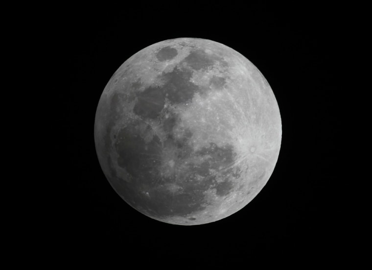 A penumbral eclipse of the moon is seen in the night sky over Manila on Wednesday. November 28, 2012. The term