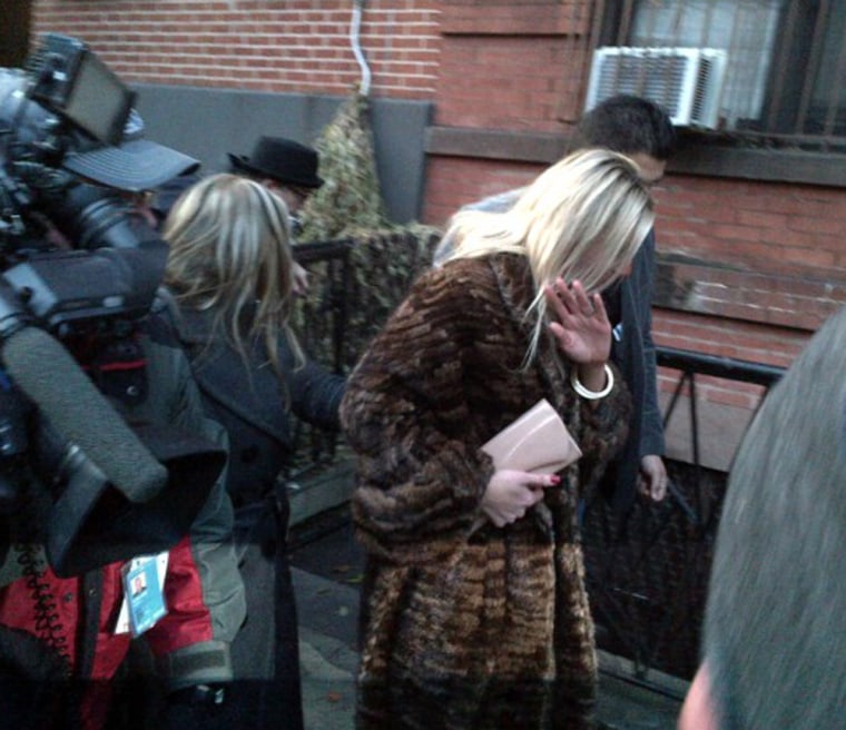 The woman wearing the fur coat was allegedly punched by Lindsay Lohan at a New York nightclub.