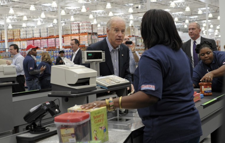 Vice President Joe Biden checks out after shopping at Costco in Washington, DC on Nov. 29.