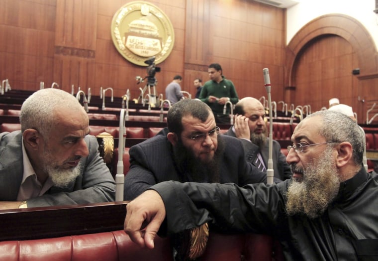 Members of Egypt's constituent assembly discuss during the last voting session on a new draft constitution at the Shoura Assembly in Cairo Nov. 29, 2012. An assembly drafting Egypt's new constitution voted on Thursday to keep the principles of Islamic law as the main source of legislation, unchanged from the previous constitution in force under former President Hosni Mubarak.