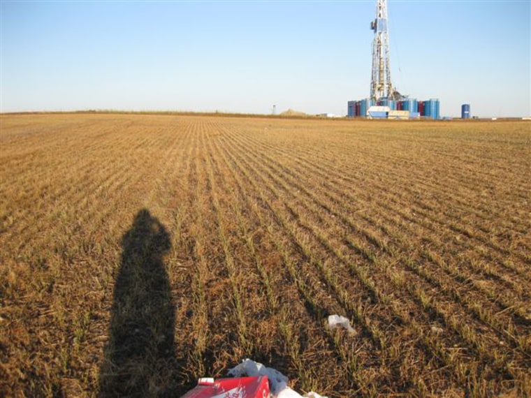 An oil-drilling rig is visible from Jacki Schilke's ranch in North Dakota.