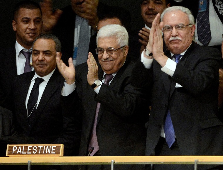 Palestinian President Mahmoud Abbas, center, Palestinian Foreign Minister Reyad al-Maliki, right, and other members of the Palestinian delegation react after a United Nations vote on a resolution to upgrade the status of the Palestinian Authority to non-member observer status on Nov. 29.
