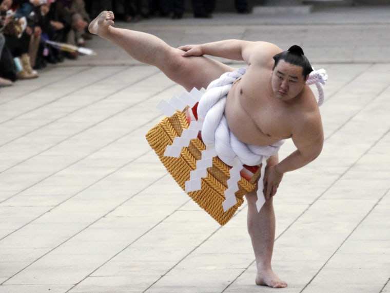 Mongolian-born grand sumo champion Yokozuna Asashoryu performs a ring-entering ritual at Meiji Shrine in Tokyo on January 6, 2010 . With a history spanning centuries, sumo once graced the Imperial courts of Japan and wrestlers were held in the highest regard. Those days are long gone. Today, sumo struggles to fill stadiums and attract new fans.