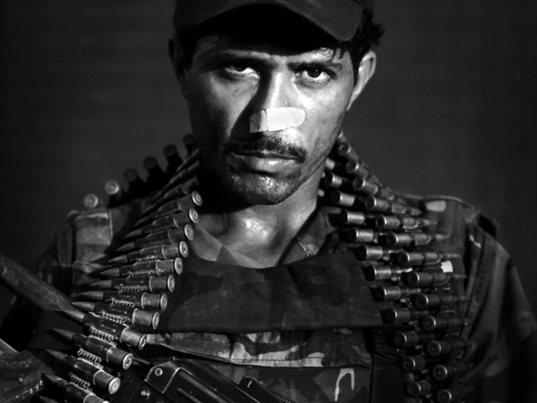 In southern Afghanistan, the focus of the U.S. war effort, nearly all the Afghan soldiers are foreigners too. Photographer Kevin Frayer shows these soldiers in a series of portraits.