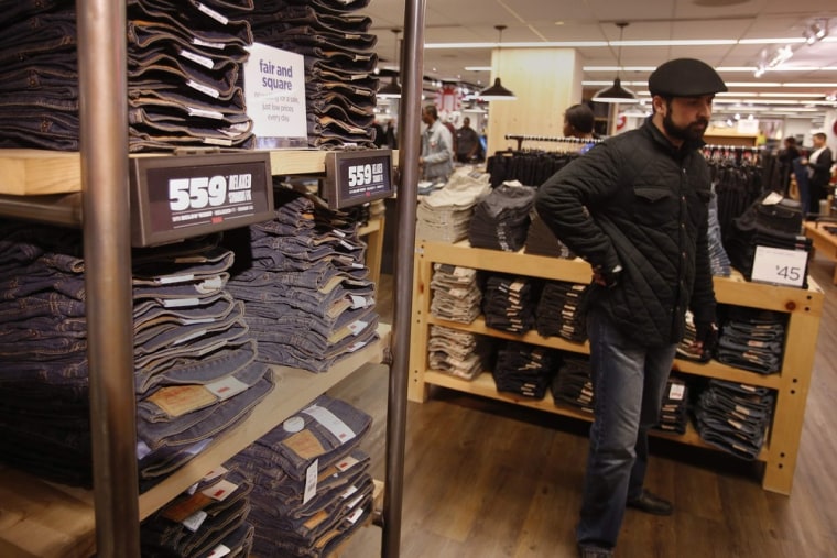 A man shops for jeans at a J.C. Penney store in New York November 27, 2012. The prior month, shoppers were less willing to open their wallets as inco...