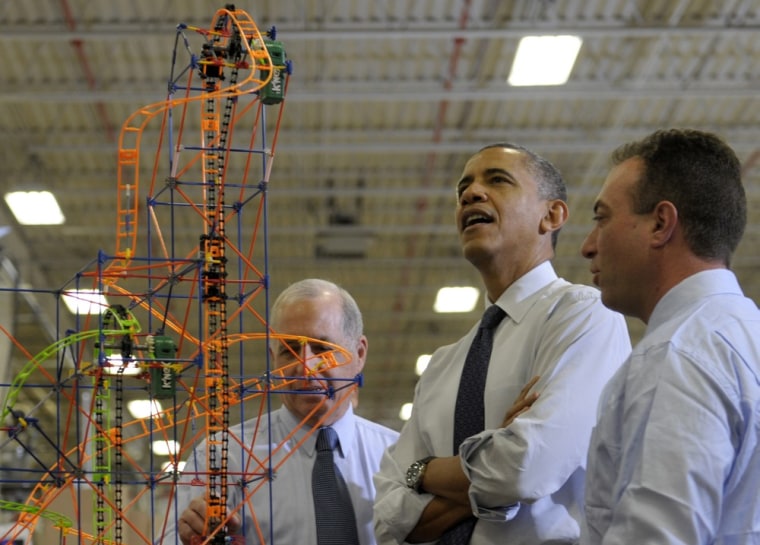 President Barack Obama looks over a rollercoaster with K'NEX Inventor Joel Glickman, left, and Rodon Group President and Chief Executive Officer Michael Araten, right, during a tour of the company in Hatfield, Pa. Friday, Nov. 30, 2012.