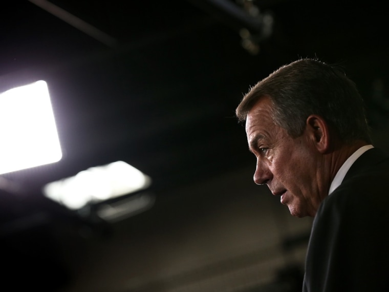 House Speaker John Boehner answers questions during a press conference September 21.