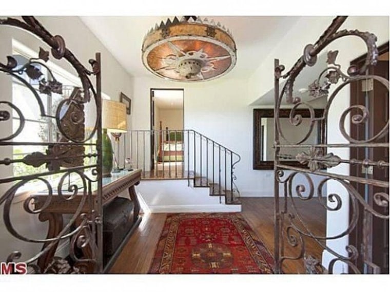 Wrought-iron and tile details fill the home.