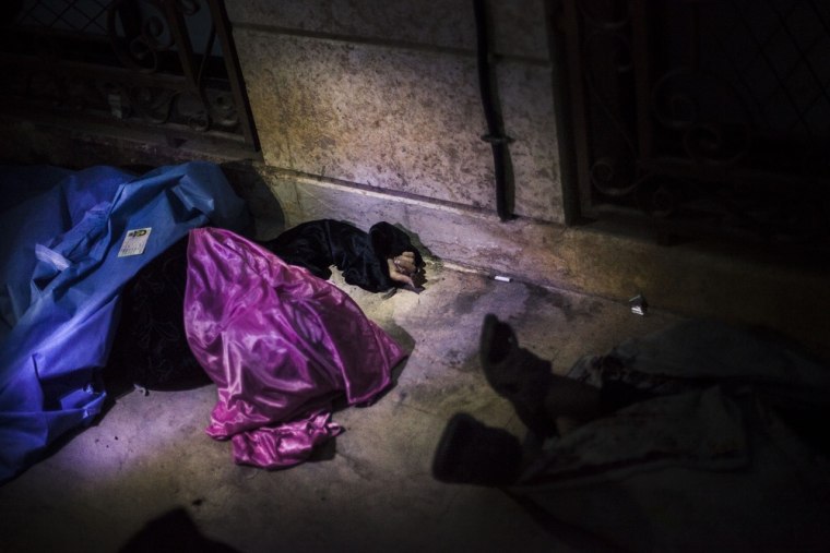The body of a Syrian woman is seen near Azaz's hospital after being shot by a sniper in the countryside around Azaz, near the Turkish border with Syria, on Oct. 1, 2012.