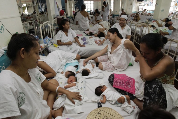 Mothers with their babies at a ward of Jose Fabella maternity hospital in Manila Sept. 12.