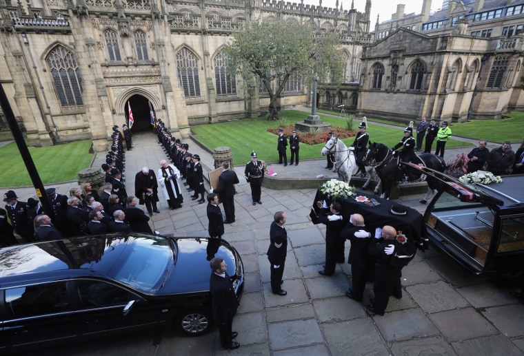 The coffin of police Constable Nicola Hughes is carried into Manchester Cathedral after processing along the city's Deansgate lined with police officers and members of the public on Oct. 3 in Manchester, England. Police Constables Nicola Hughes, 23, and her police colleague Fiona Bone, 32, were killed as they responded to what they thought was a routine burglary call in Mottram, Greater Manchester and were murdered in a gun and grenade attack. The funeral of Fiona Bone also takes place at the cathedral tomorrow. A local man, Dale Cregan, 29, appeared before Manchester Magistrates last week accused of four murders, including those of PC Nicola Hughes and PC Fiona Bone on Sept. 18.