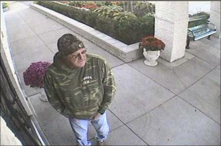 A security video captures an image of a man -- believed to be Randy Linn, 52, of Indiana -- who lingered outside the Islamic Center of Greater Toledo as a fire burned inside. Linn was charged Wednesday.