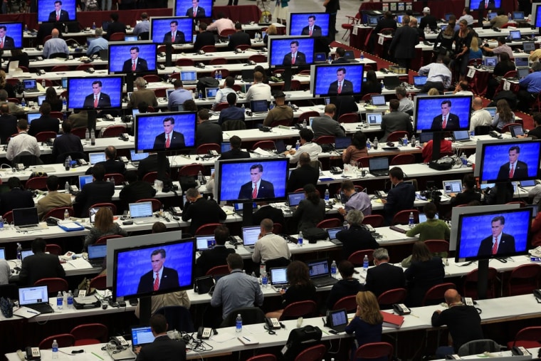 Reporters watch the final minutes of the Presidential Debate between Democratic presidential candidate, U.S. President Barack Obama and Republican presidential candidate, former Massachusetts Gov. Mitt Romney at the University of Denver on Oct. 3, 2012 in Denver, Colorado. The first of four debates for the 2012 Election, three Presidential and one Vice Presidential, is moderated by PBS's Jim Lehrer and focuses on domestic issues: the economy, health care, and the role of government.