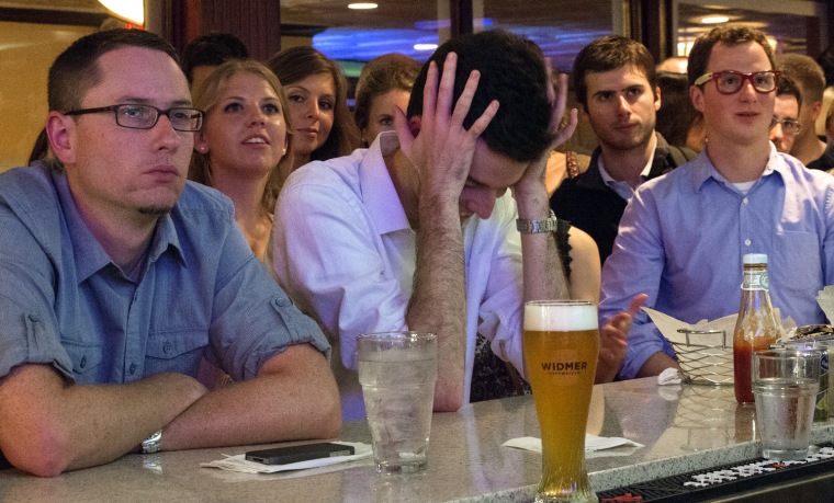 Patrons watch the debate at Bullfeathers, a historic bar just feet from the US Capitol in Washington, DC.