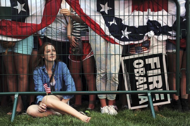 Rachael Bass, 20, a supporters of Republican presidential candidate Mitt Romney watches a band perform at the University of Denver before the first presidential debate.