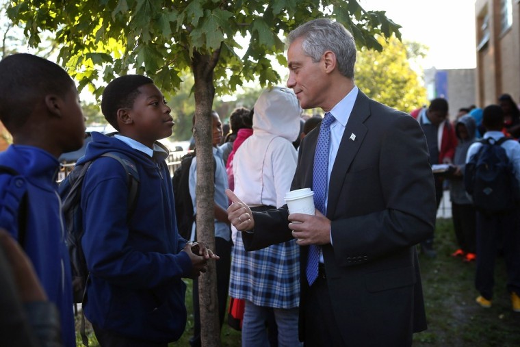 Mayor Rahm Emanuel greets students as they arrive for school at Frazier International Magnet School on September 19, 2012 in Chicago, Illinois.