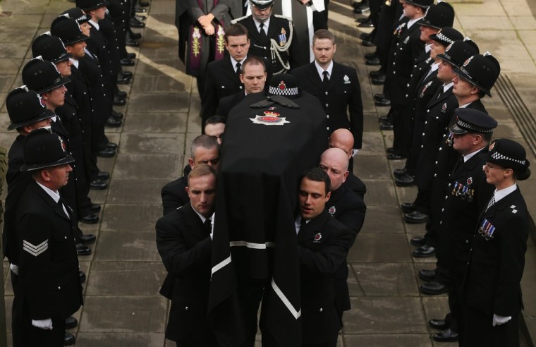 The coffin of police Constable Fiona Bone leaves Manchester Cathedral after her funeral service on Oct. 4, in Manchester, England.
