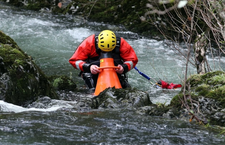 Members of a mountain rescue team search the River Dyfi as the hunt for missing April Jones continues on Oct. 4 in Machynlleth, Wales.