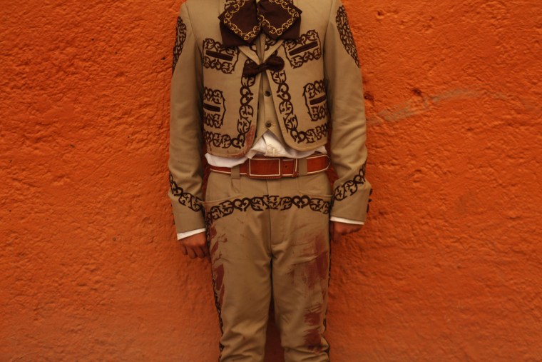 Apprentice bullfighter Mario 'mayito' Bueno, 13, poses for a photograph during an Under 14 Apprentice Bullfighting competition at the Arroyo bullring in Mexico City, Sept. 8.