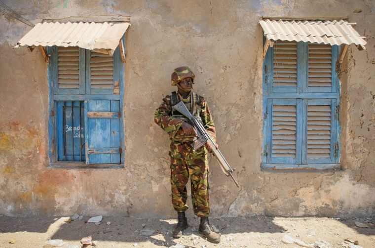 A Kenyan soldier stands guard in the center of the southern Somali port city of Kismayu on Oct. 5.