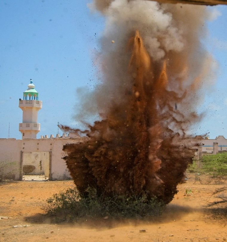 Unexploded ordnance, including rocket-propelled grenades and mortar shells left behind by the Al-Qaeda-affiliated extremist group Al Shabaab, are destroyed in a controlled detonation in Kismayu on Oct. 5.