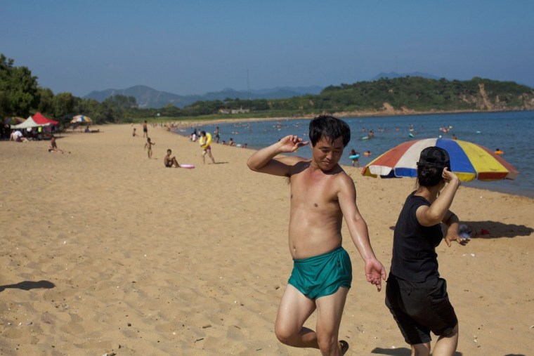 Two people dance at Majon beach near Hamhung, North Korea on Aug. 11.
