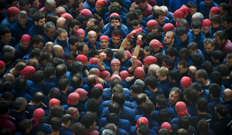Members of the Colla 'Capgrossos de Mataro' start a construction of a human tower during the 24th Tarragona Castells Comptetion on Oct. 7, in Tarragona, Spain.