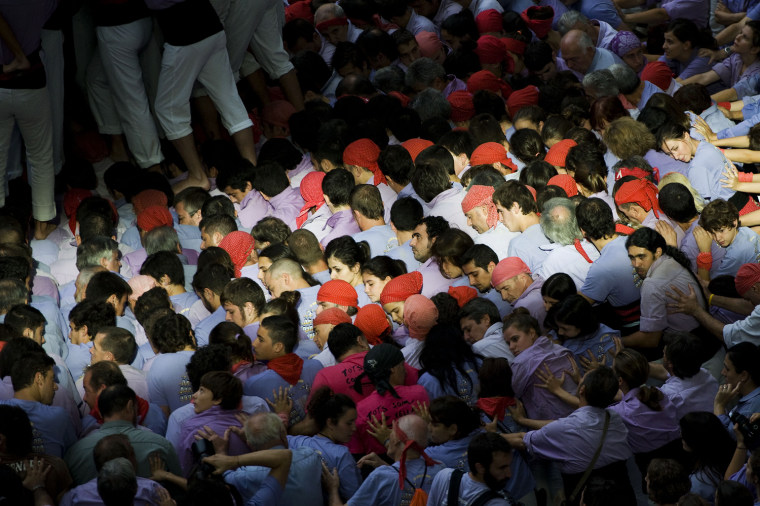 Members of the Colla 'Jove de Tarragona' start a construction of a human tower during the 24th Tarragona Castells Comptetion on Oct. 7, in Tarragona, Spain.