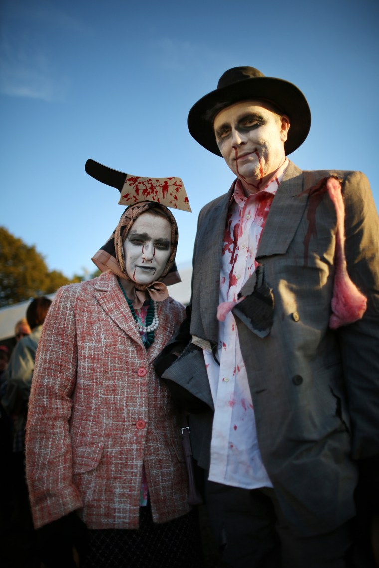 Visitors to the Shocktober Fest dressed as zombies pose at Tulleys Farm on Oct. 6, in Turners Hill, England.