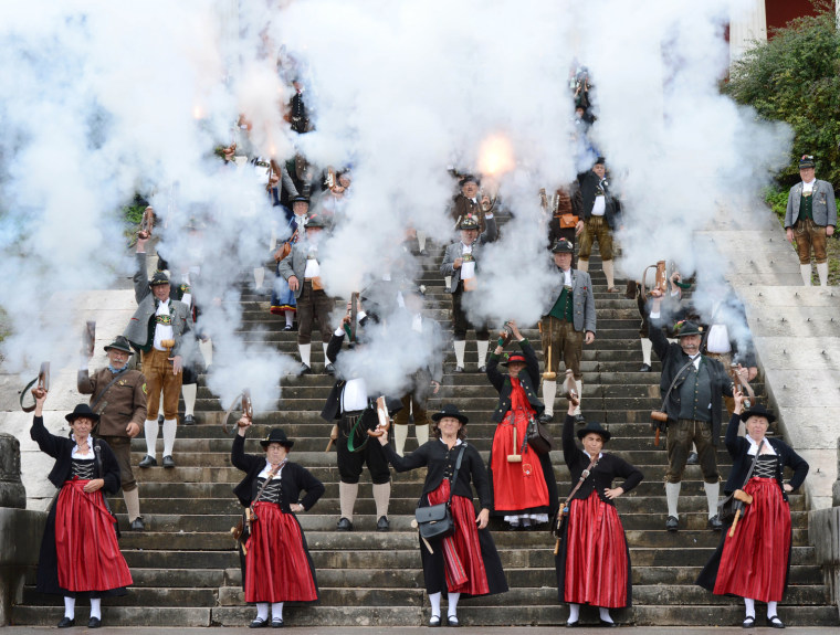 Bavarian riflemen fire gun salute on the steps of the Bavaria monument at the Theresienwiese fair grounds of the Oktoberfest beer festival in Munich, southern Germany, on Oct. 7, the last day of the world famous beer festival.