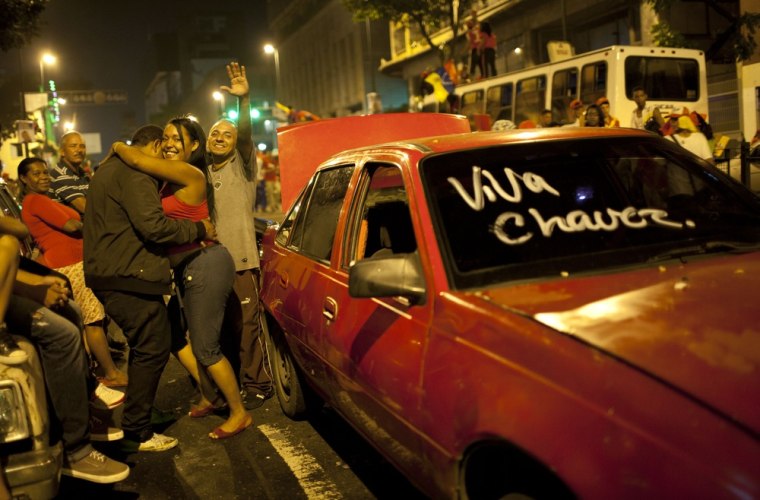 Supporters of Hugo Chavez celebrate in downtown Caracas on Oct. 7, 2012. Chavez won re-election and a new endorsement of his socialist project Sunday, surviving his closest race yet after a bitter campaign against opposition candidate Henrique Capriles.