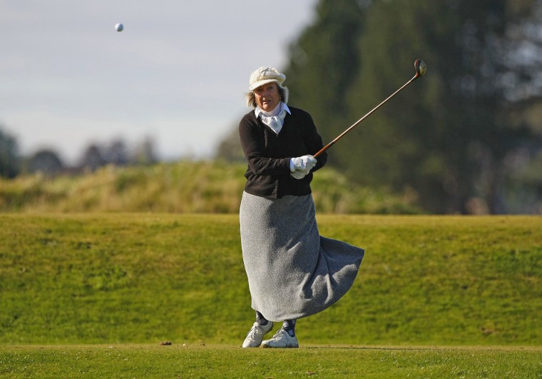 A competitor tees off at the fifth hole.