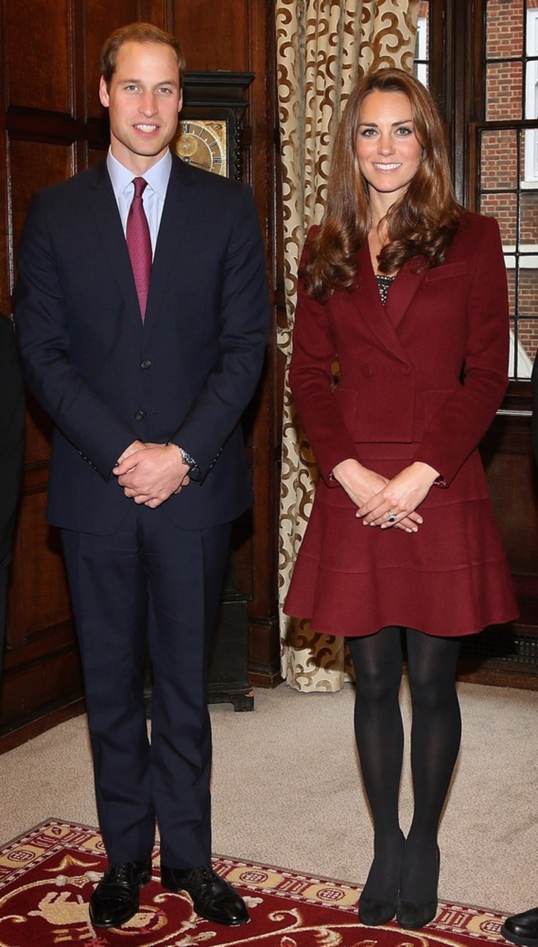 Save it for the Christmas card, kids: The royal couple do their best formal photo poses.
