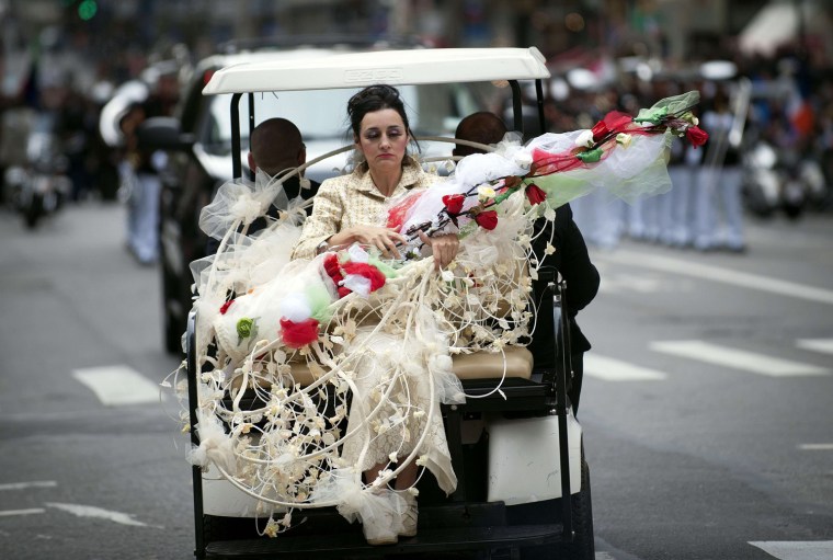 A parade participant is driven on a golf cart during the annual Columbus Day Parade along Fifth Avenue in New York on Oct. 8.