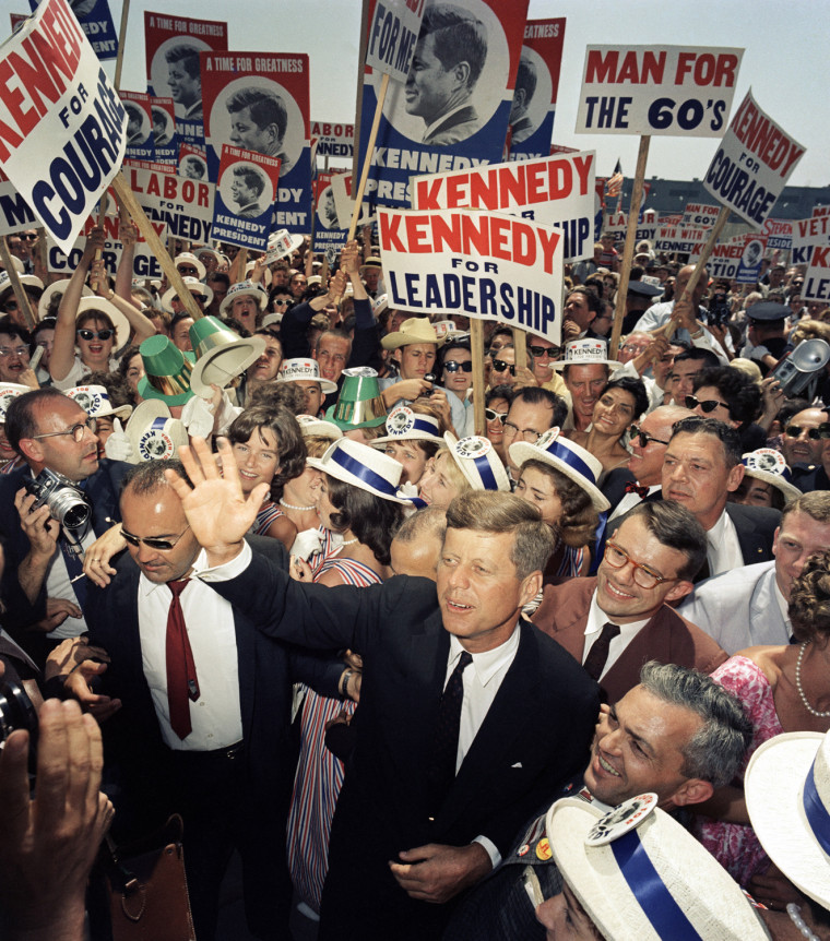 Sen. John F. Kennedy makes his way through a crowd of supporters and journalists as he arrives in Los Angeles, July 9, 1960 for the Democratic National Convention.