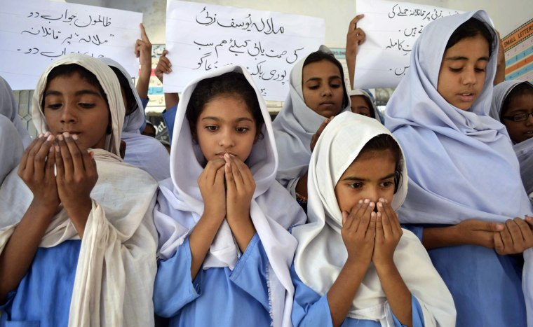 Pakistani school girls pray for the recovery of gunshot victim, Malala Yousufzai, in Multan on Oct. 10. Pakistani doctors removed a bullet from a 14-year-old child campaigner shot by the Taliban in a horrific attack condemned by national leaders and rights activists. The attack took place in Mingora, the main town of the Swat Valley in Pakistan's northwest, where Malala had campaigned for the right to an education during a two-year Taliban insurgency which the army said it had crushed in 2009.