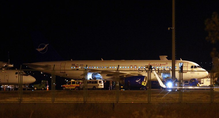 A Syrian passenger plane is seen after it was forced to land at Ankara airport in Turkey, on Wednesday. The plane was headed to Damascus from Moscow with 35 passengers on board, according to Turkish media.
