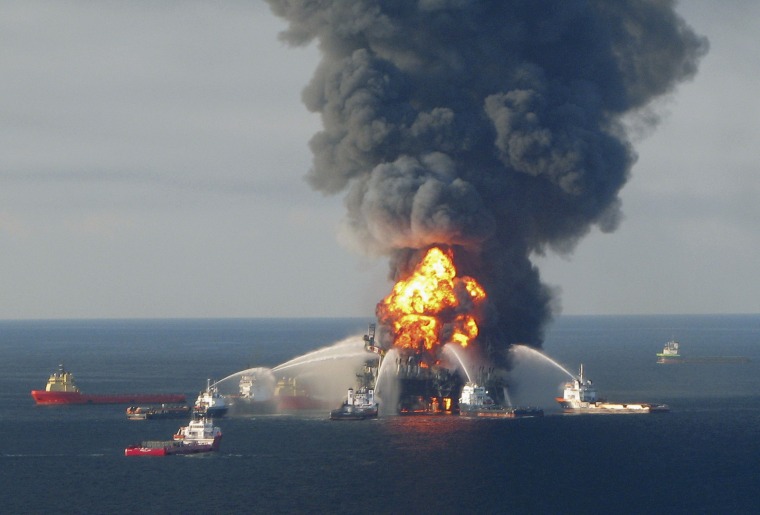 The Deepwater Horizon oil rig burns on April 21, 2010. Eleven workers died and 4.9 million barrels of oil were spilled.