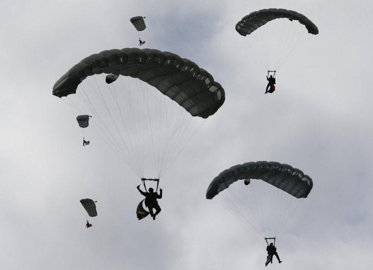 Parachutists of the Swiss Air Force perform during a flight demonstration over Axalp in the Bernese Oberland on Oct. 11.