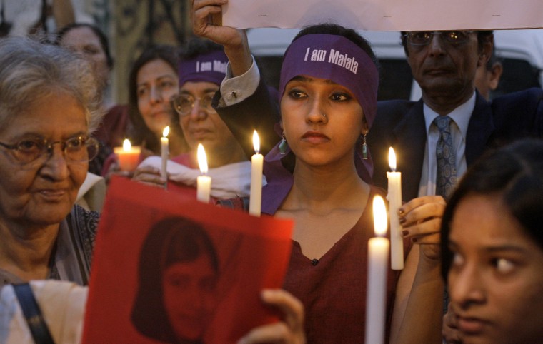 Pakistanis hold candles during a protest to condemn the attack on Malala Yousufzai in Karachi, Pakistan, on Oct. 11.